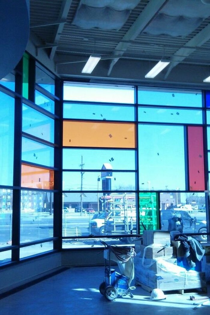 Colorful commercial storefront glass panel installation by Kent Glass in Colorado Springs