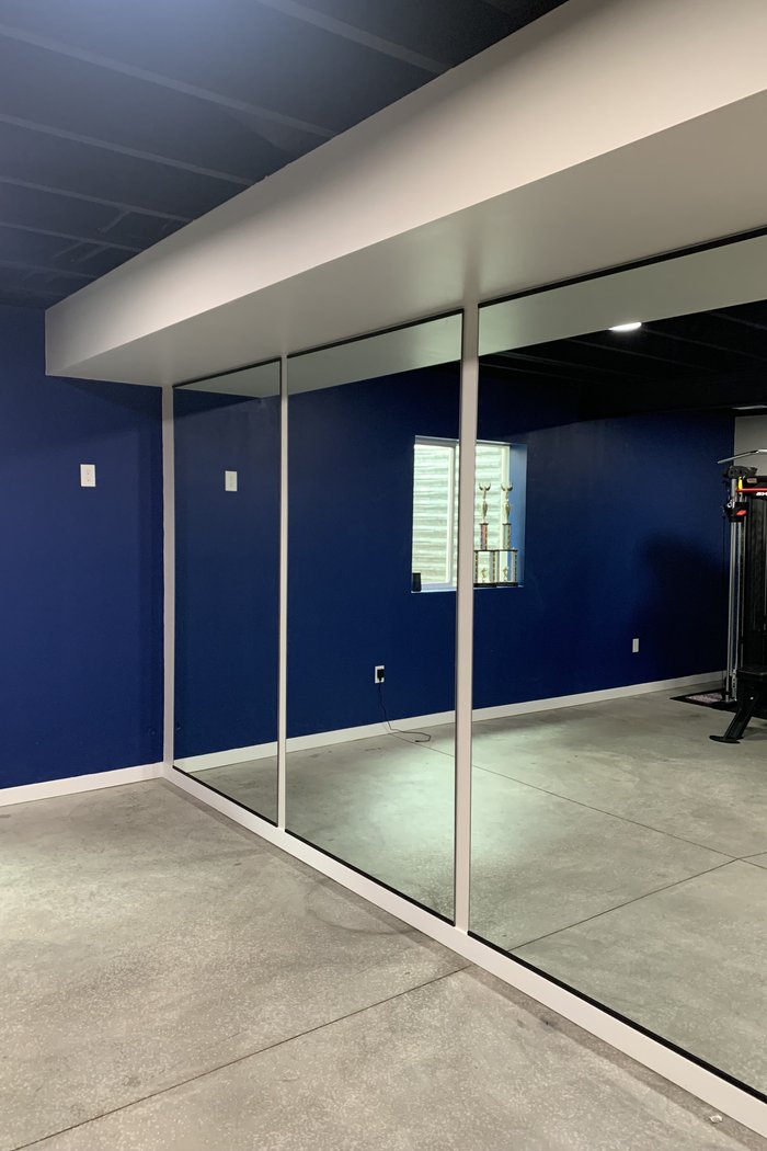Home gym mirror wall installation by Kent Glass in Colorado Springs