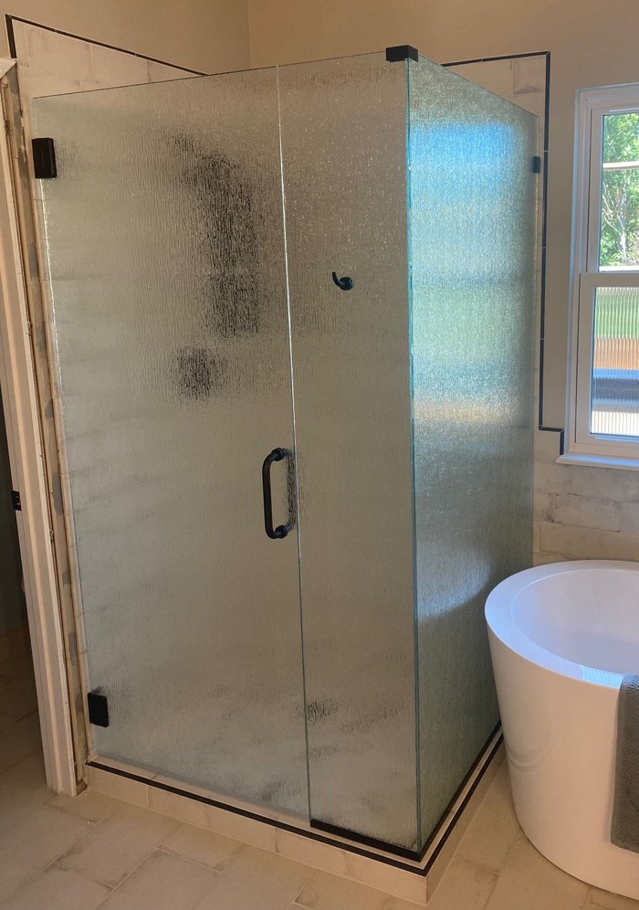 Frameless rain glass shower with robe hook and matte black hardware