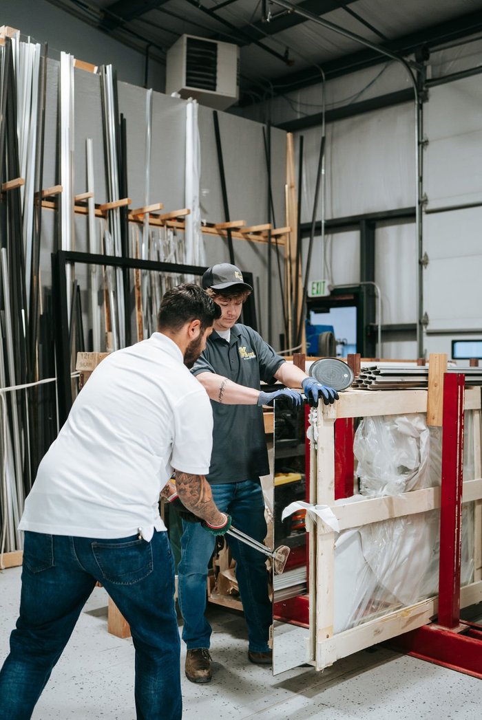 Kent Glass team moving glass through the fabrication shop