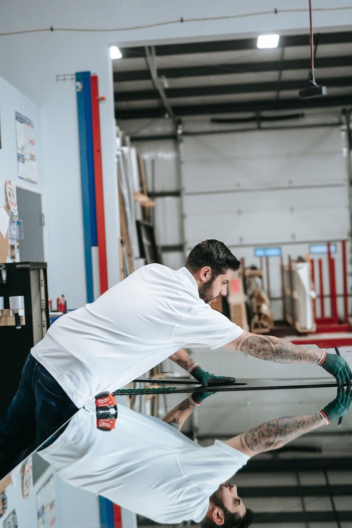 Kent Glass technician inspecting glass for a home builder in Colorado Springs