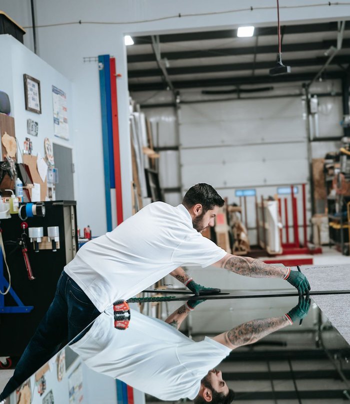 Kent Glass technician inspecting glass in Colorado Springs