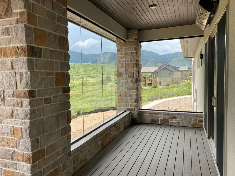 Outdoor deck glass panels with a mountain view in Colorado Springs